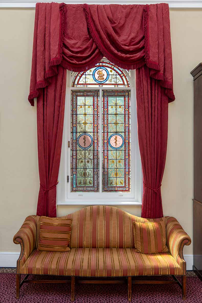 Lettsom House ornate stained glass window and sofa